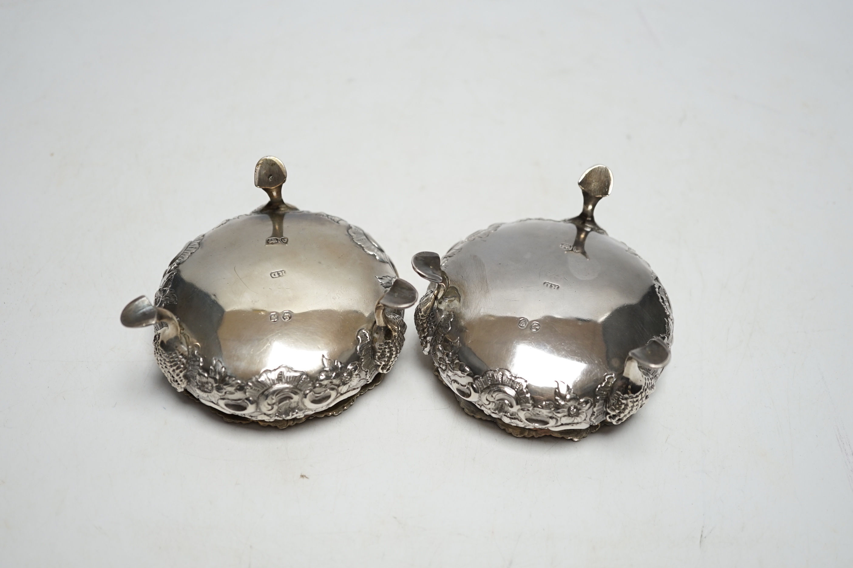 A pair of Victorian embossed silver bun salts, London, 1848, diameter 75mm.